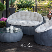 Outdoor Wicker Lounge Set. Includes 2 armchairs, sofa and coffee table