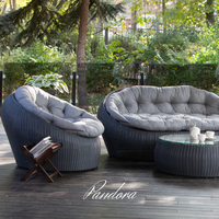 Outdoor Wicker Lounge Set. Includes 2 armchairs, sofa and coffee table