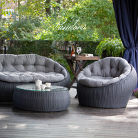 Outdoor Wicker Lounge Set. Includes 2 armchairs, sofa and coffee table